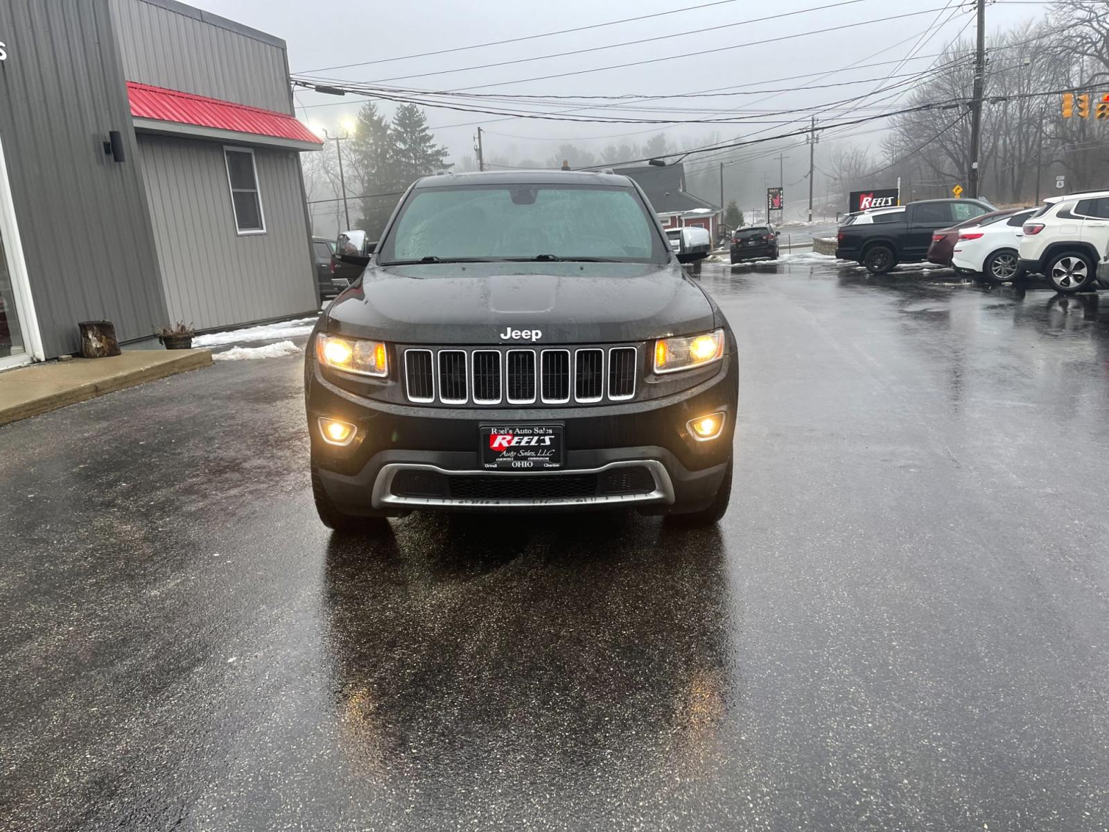 2015 Black /Black Jeep Grand Cherokee Limited 4WD (1C4RJFBG2FC) with an 3.6L V6 DOHC 24V FFV engine, 8-Speed Automatic transmission, located at 547 E. Main St., Orwell, OH, 44076, (440) 437-5893, 41.535435, -80.847855 - This 2015 Jeep Grand Cherokee Limited 4WD comes equipped with a 3.6L Pentastar V6 engine paired with an 8-speed automatic transmission, offering a blend of power and efficiency. It boasts a luxurious leather interior with both front and rear heated seats for comfort in various climates. For convenie - Photo #1